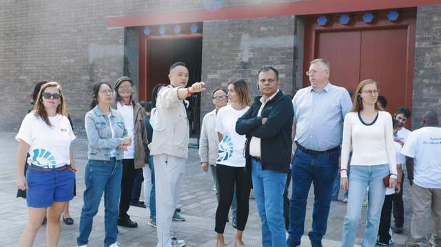 触摸千年脉动，共筑文明之桥——人类命运共同体国际智库论坛嘉宾开启北京中轴线文化体验之旅(图3)